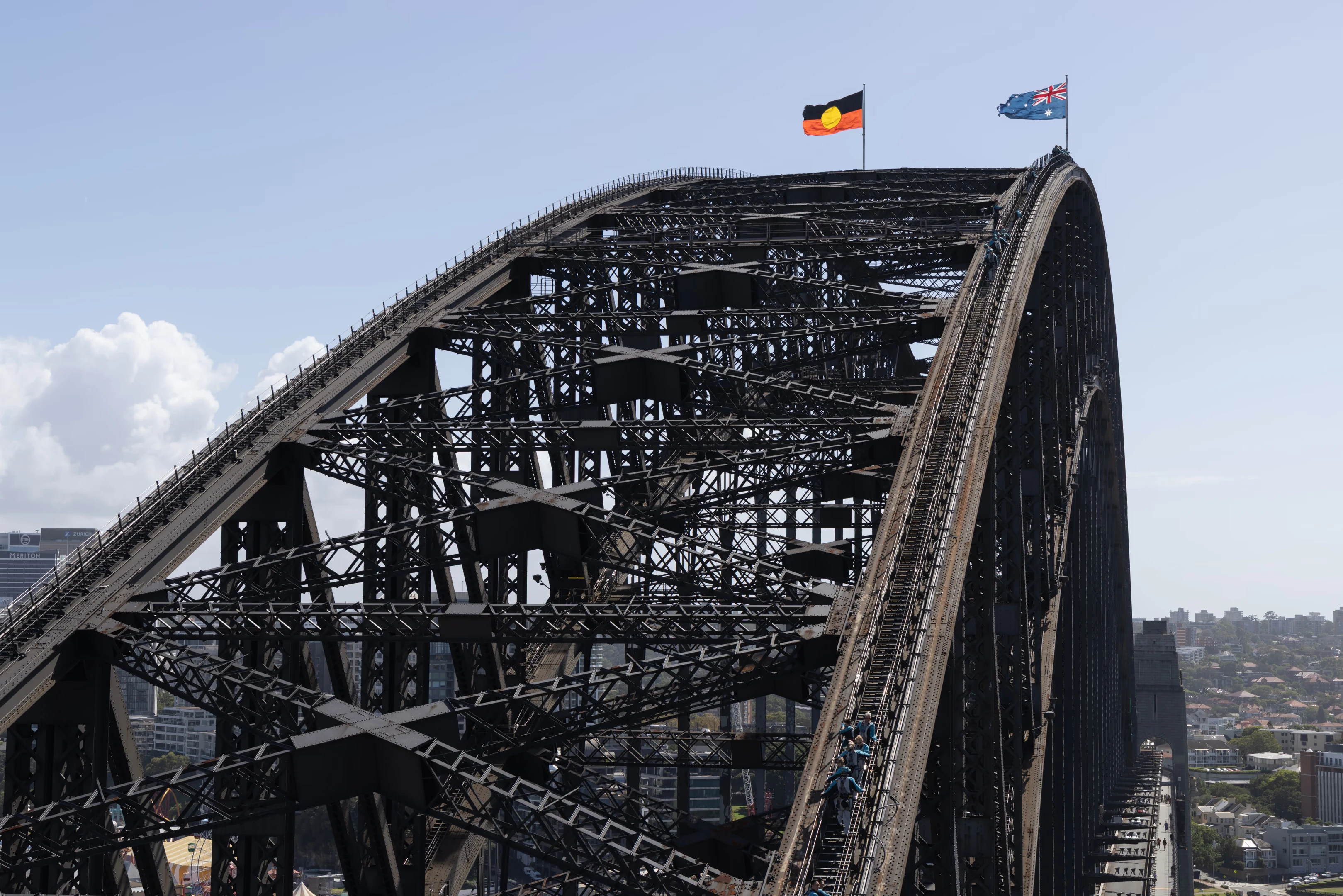 The Sydney Harbour Bridge arch with the Australian and Aboriginal flags at the top of the bridge