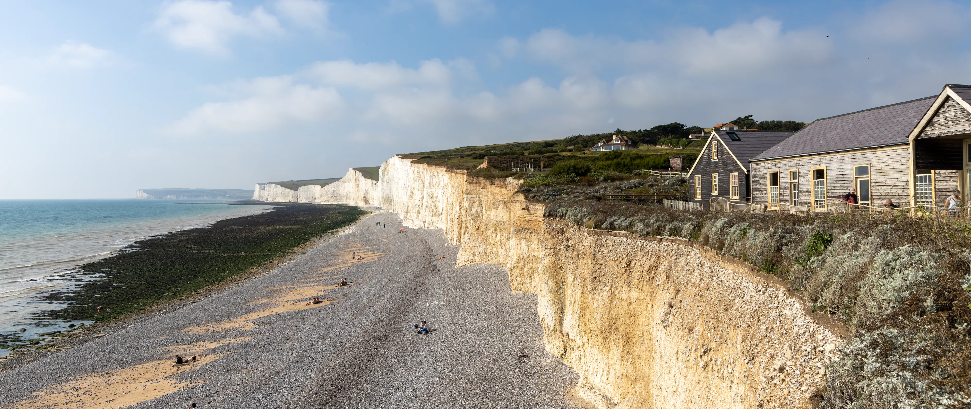 A photo of chalf cliffs and a shingle beach