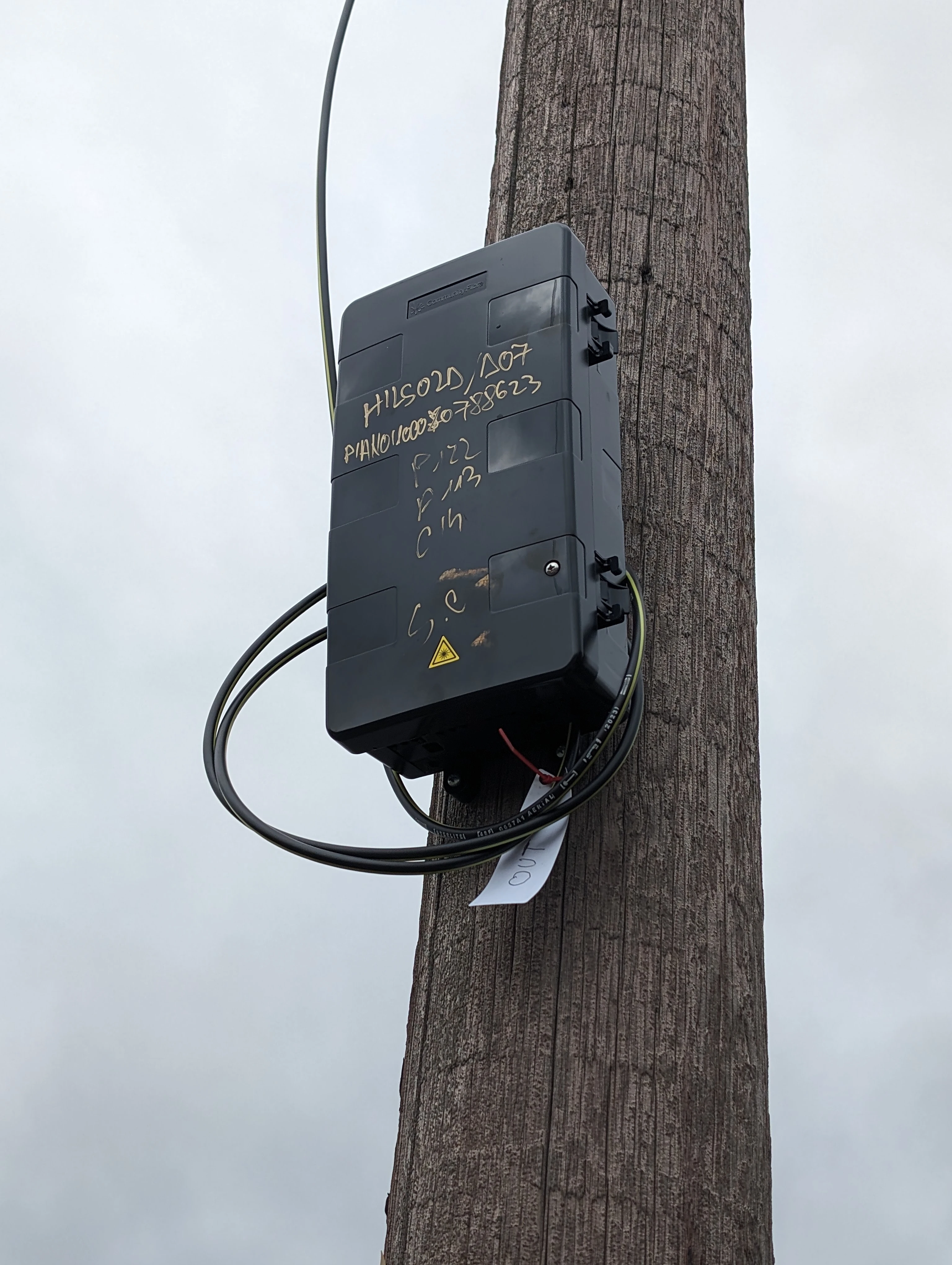 A photo of an aerial fibre node on a telegraph pole.