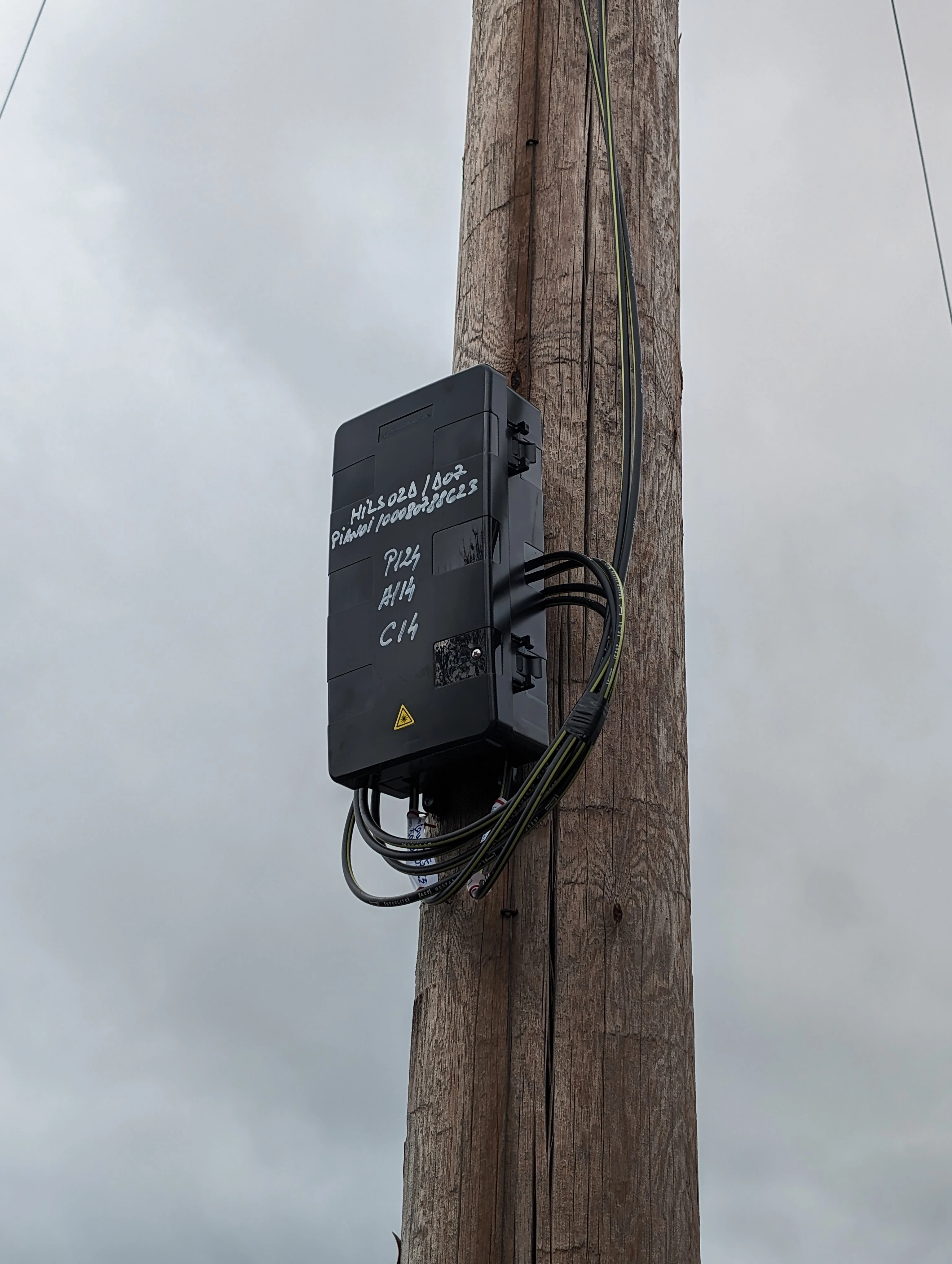 A photo of an aerial fibre node on a telegraph pole.