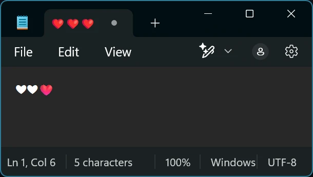 A screenshot of Notepad showing three colour hearts in a tab and two black hearts followed by a colour heart in the main typing area