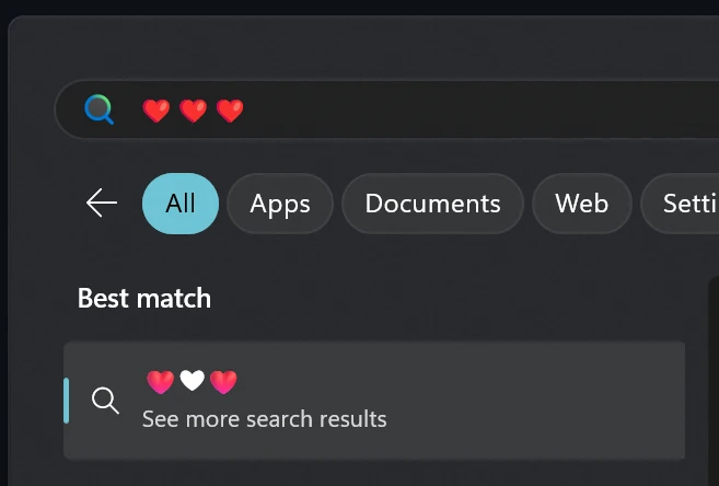 A screenshot of the Start Menu after performing a search, showing three colour hearts in the search box and a colour heart following by a white heart and another colour heart in the search results area
