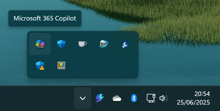 A screenshot of the system tray with the tooltip for the Microsoft 365 Copilot icon visible.